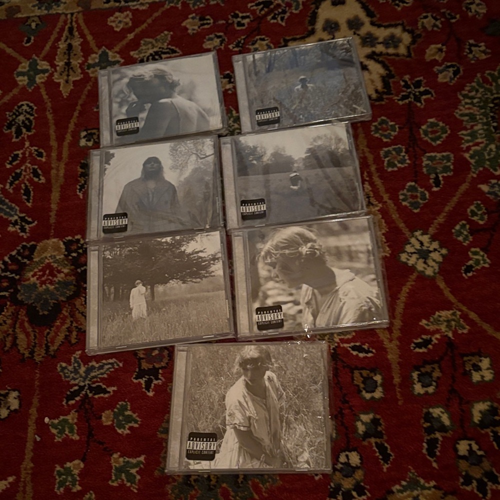 Collection of Taylor Swift Folklore CDs